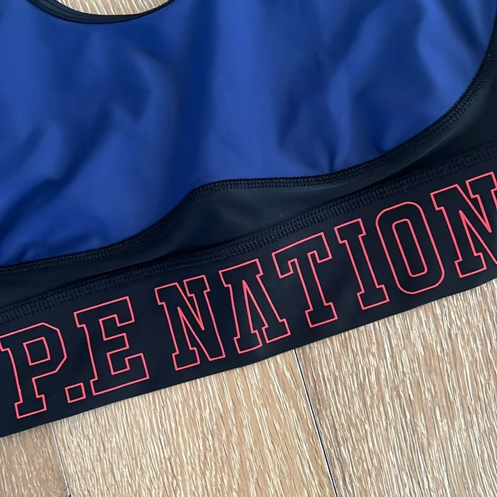 P.E Nation Navy Blue and Black Sports Bra with Red Logo